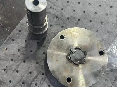 Damaged pump-to-engine drive shaft and coupling removed during industrial diesel hot pressure washer repair in Dover